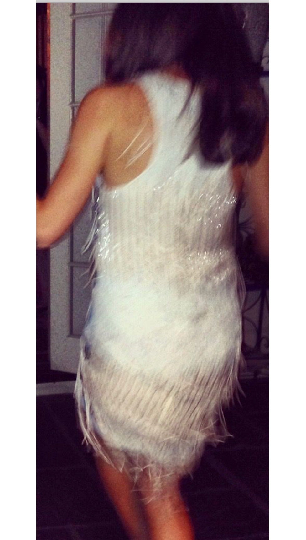 In a beaded fringe dress celebrating New Year&rsquo;s Eve